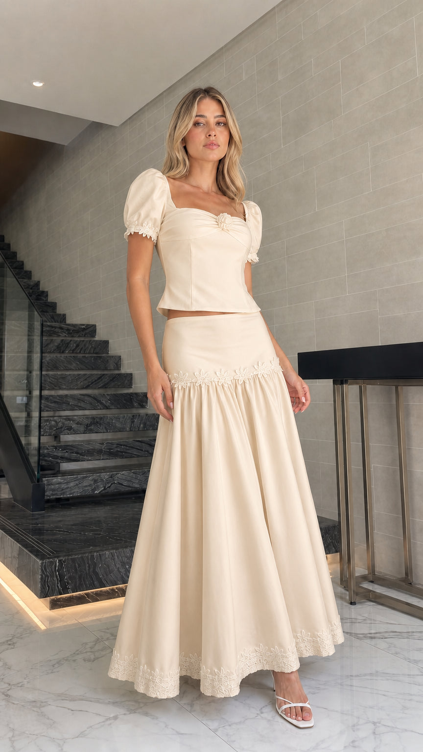 Model wearing beige puff sleeve crop top and maxi skirt set