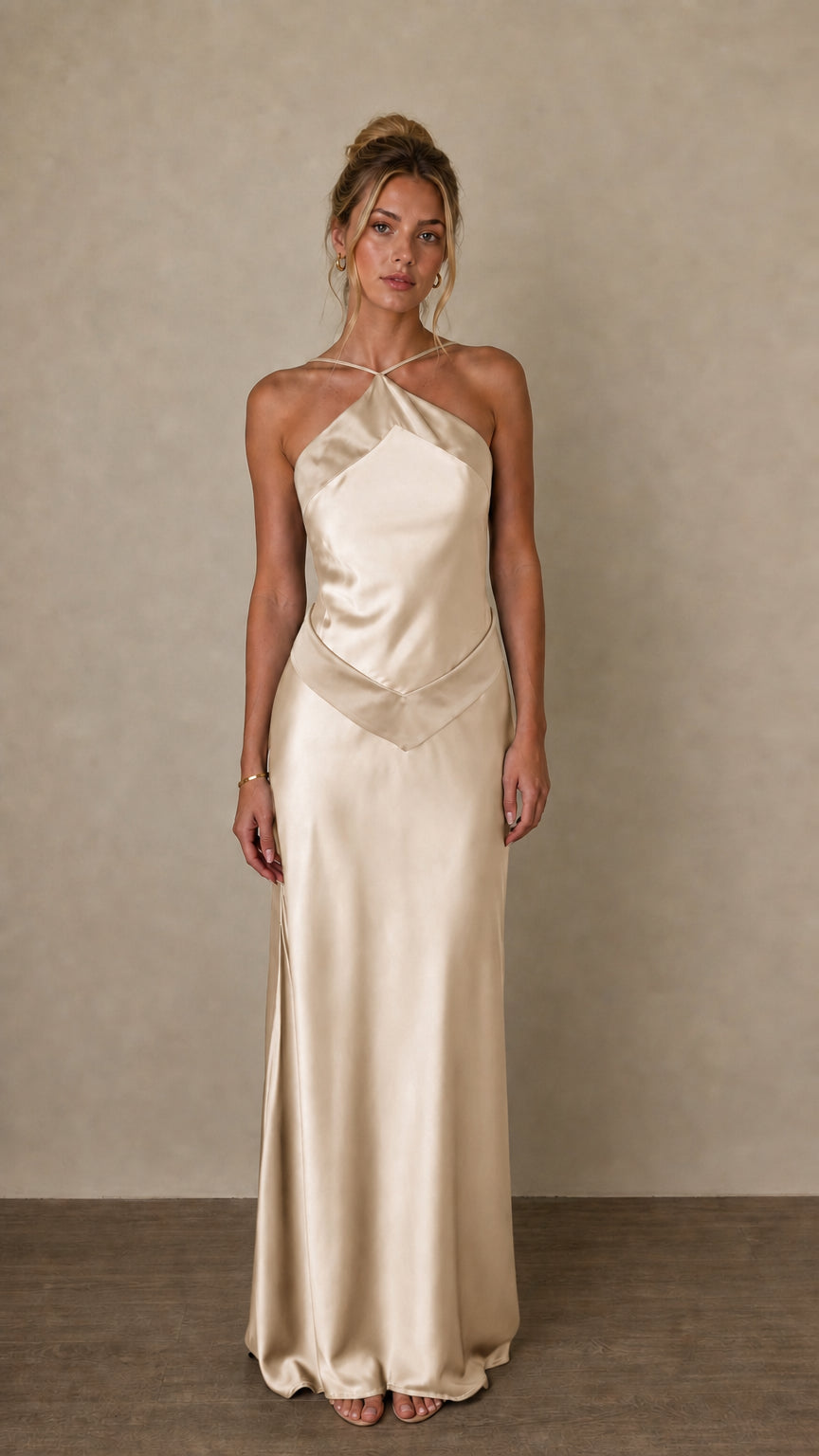 Front view of champagne satin halter maxi dress on model