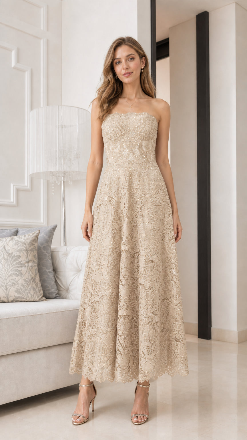 Front view of model wearing champagne strapless lace midi dress