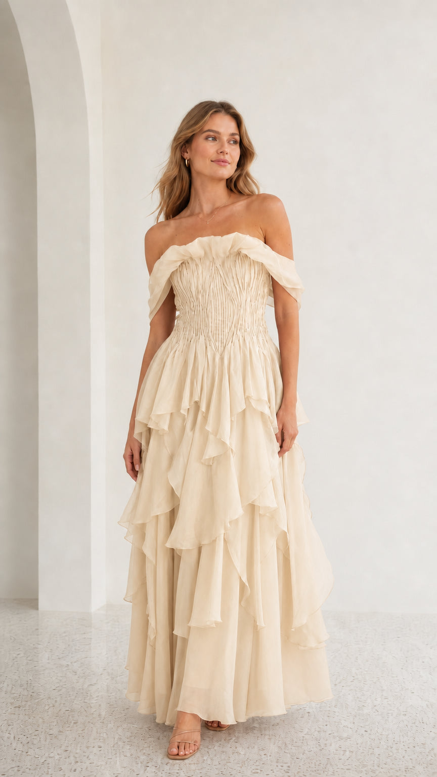 Front view of champagne off-shoulder tiered maxi dress