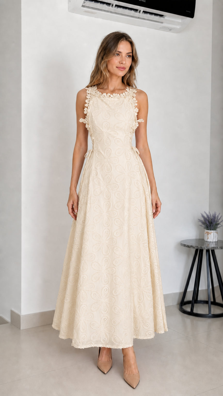 Model wearing beige embroidered eyelet maxi dress