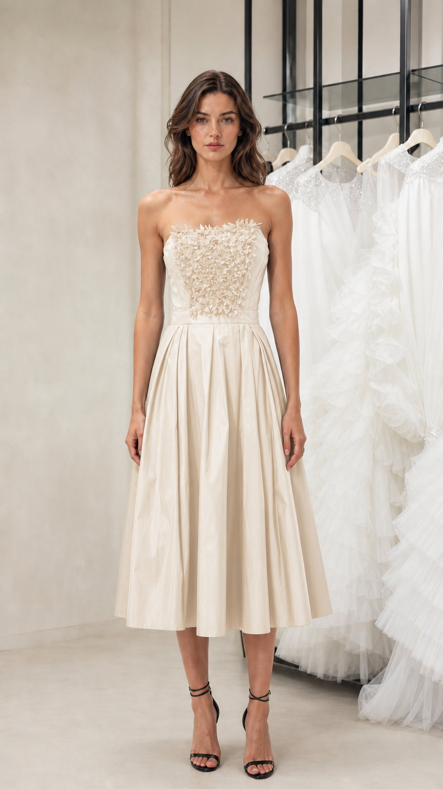 Front view of model wearing champagne strapless midi dress
