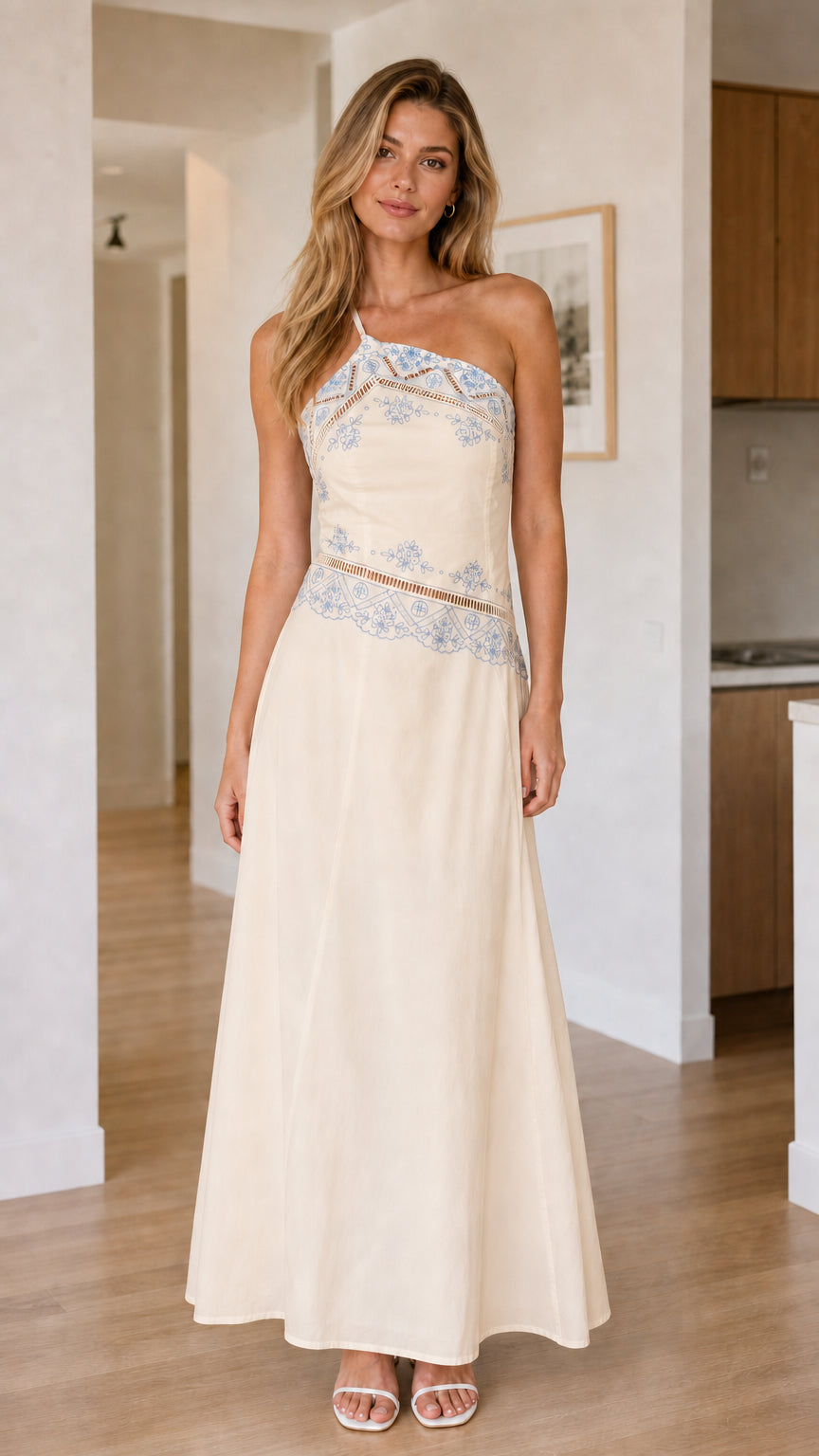 Front view of cream one-shoulder embroidered maxi dress